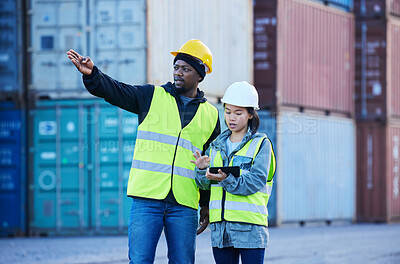 Buy stock photo Logistics, tablet and employees working in shipping and doing inspection on a container at a port. Team of industrial workers talking and planning cargo freight on mobile app with technology at work