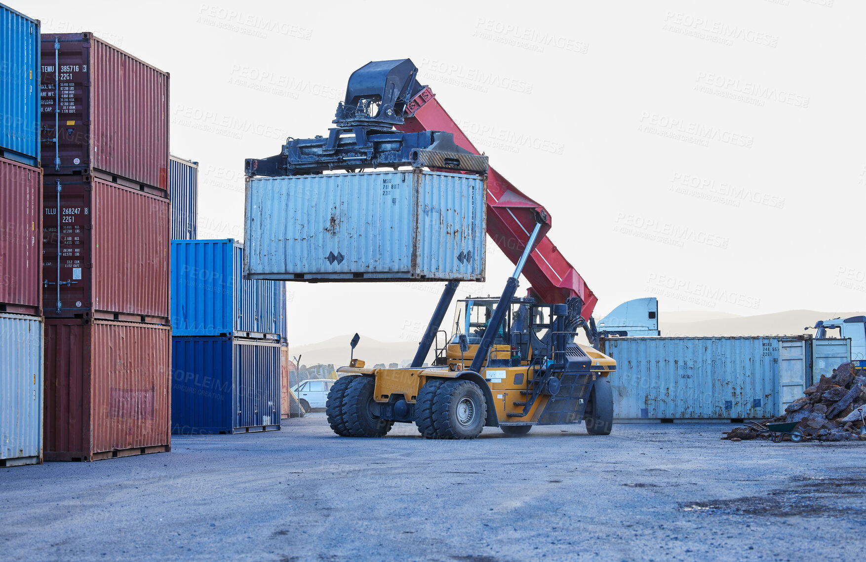 Buy stock photo Logistics, cargo and forklift with container with stock for delivery in an industrial port. Ecommerce worker working with transportation of manufacturing product with a crane at an outdoor warehouse