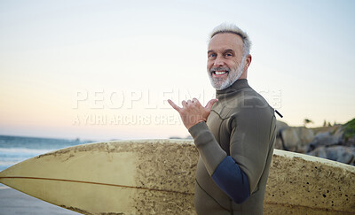Buy stock photo Summer, surfing and portrait of old man at the beach in the morning. Retired senior man with surfboard, hand sign and smile on face ready to surf at sunrise. Ocean, hobby and water sport in Australia