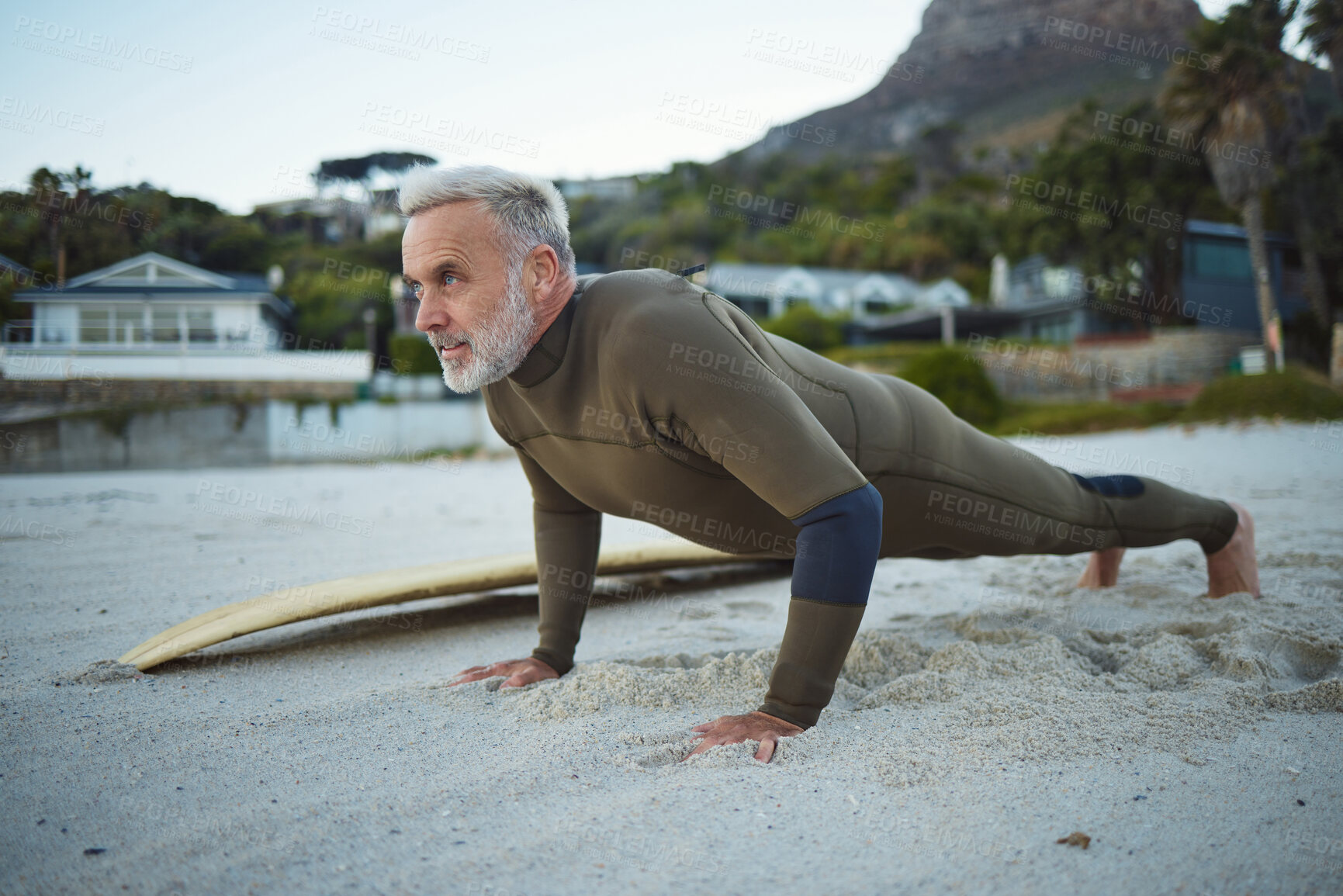 Buy stock photo Senior man, beach and fitness in South Africa of surfer in exercise for morning routine warm up. Elderly male in surfing sports and training pushups getting ready for healthy workout by the ocean