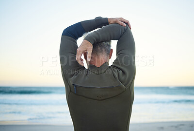 Buy stock photo Fitness, surf and man stretching on beach to warm up before training in ocean water. Fitness, freedom and surfer with wellness, health and active lifestyle doing arm exercise for surfing at seaside.
