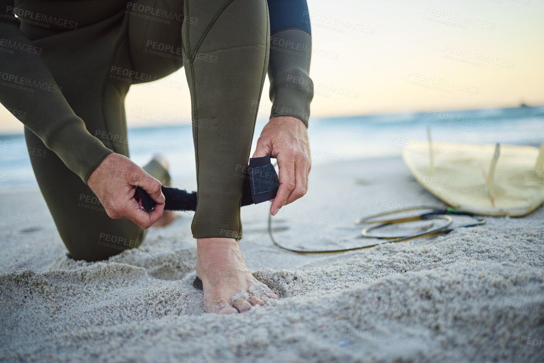 Buy stock photo Foot, with surfboard and leash on sand prepare to enter sea, on beach and to relax on holiday, vacation and wet suit. Surfing, healthy man and ready to surf ocean for wellness and health on seaside.