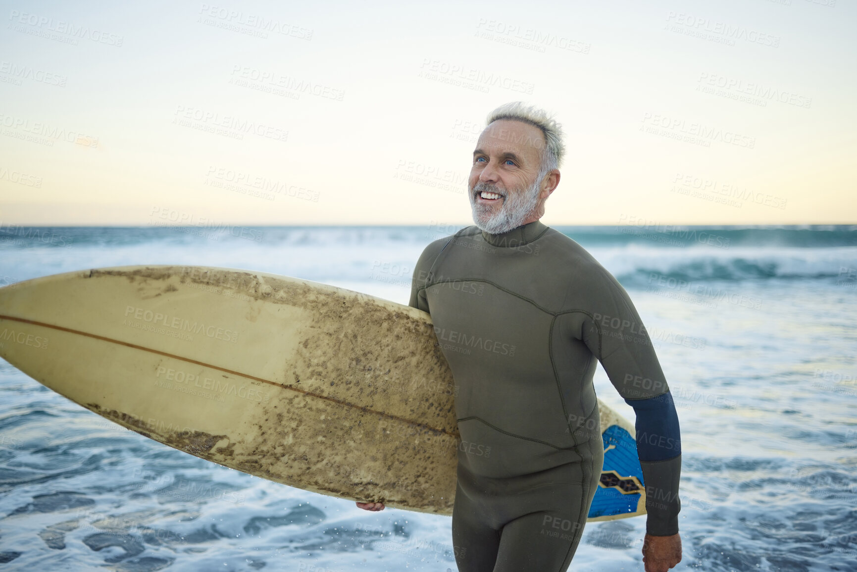 Buy stock photo Water, happy and man surfing at the beach on a tropical holiday in Hawaii during sunrise in summer. Mature surfer with smile for the waves in ocean on vacation on an island for travel and adventure