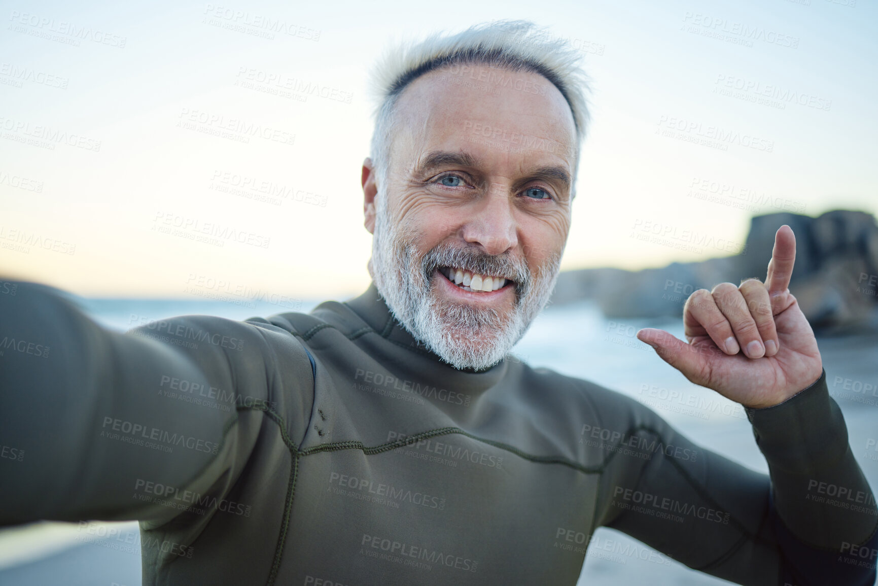 Buy stock photo Beach, selfie and a happy elderly surfer man at water on weekend morning. Freedom, ocean and happiness, fun on retirement surf holiday in Hawaii. Health, nature and senior on video call at the sea.