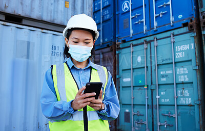 Buy stock photo Covid, supply chain logistics and phone with a woman shipping worker managing an online order on a container dock. Stock, freight and cargo with a female courier at work on a smartphone for export