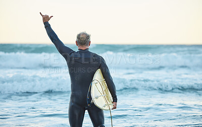 Buy stock photo Beach, freedom and man surfing on holiday by the sea in Australia for travel and adventure during summer. Back of surfer with shaka hand sign for free vacation by the ocean and water in nature