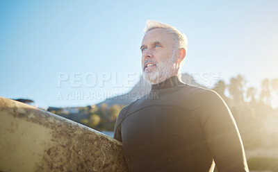 Buy stock photo Surfboard, fitness and senior man surfer, ready to surf in Costa Rica on summer vacation or holiday. Travel, retired and elderly male preparing for surfing sports, recreation or training exercise.
