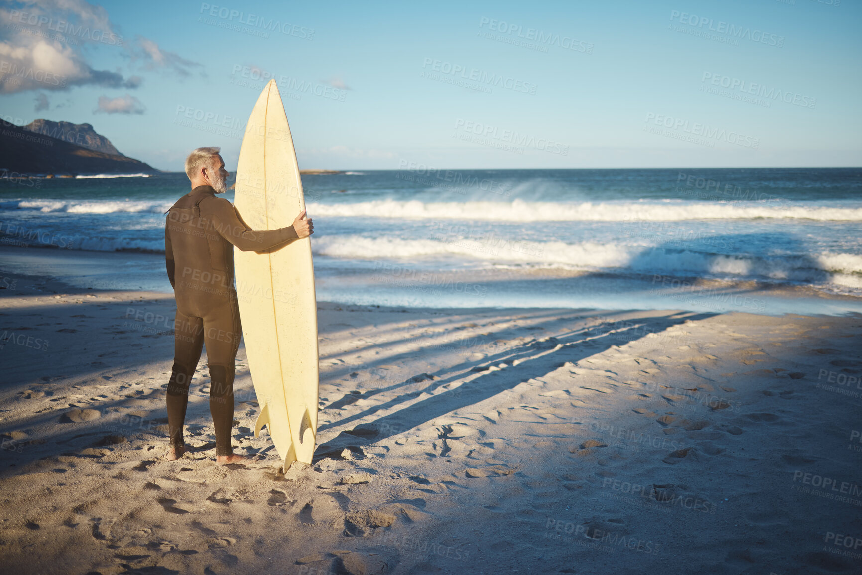 Buy stock photo Beach, board and man surfing on holiday in the summer water of Brazil during retirement freedom. Back of mature surfer on travel vacation by the ocean on an island for the waves with his surfboard