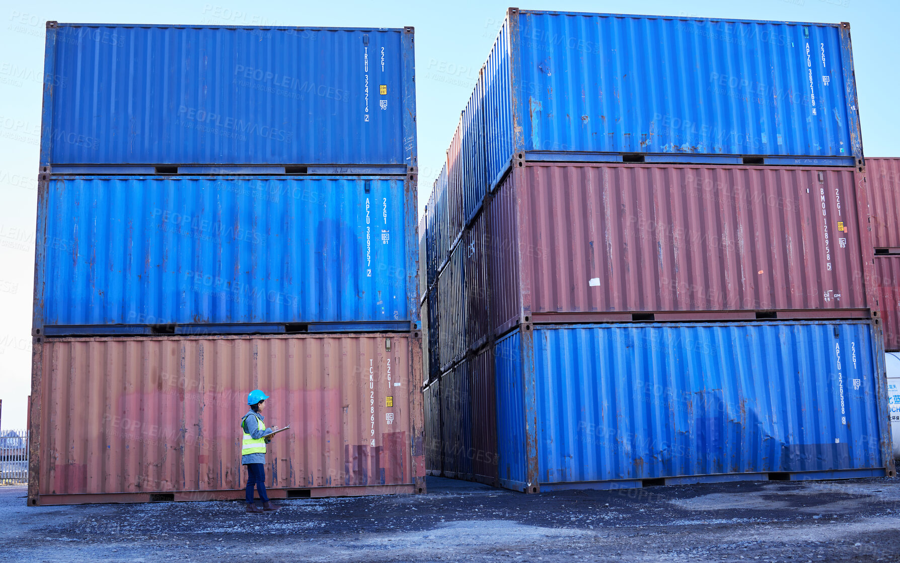 Buy stock photo Logistics, supply chain and woman in container port checking inventory list for global freight company. Industrial shipping yard, female inspector counting cargo stack for delivery in storage area.