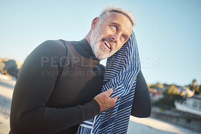 Buy stock photo Surfer, towel and swimming with senior man drying hair after a swim, surf and water sports while on a surfing trip, adventure and summer vacation. Happy male smiling in a wetsuit while on holiday 