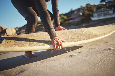 Buy stock photo Hands, surfboard and beach surfer man on holiday, vacation or summer trip in Hawaii. Fitness, workout and male pick up board ready for surfing sports, fitness or exercise by sandy seashore outdoors.