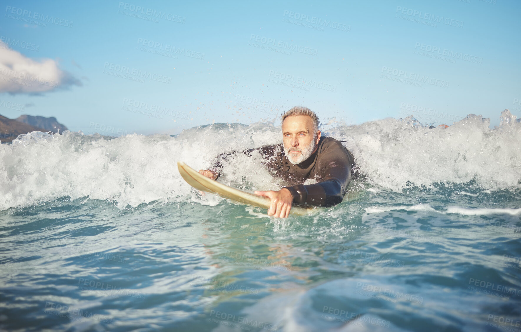 Buy stock photo Ocean waves, senior man surfing on beach and healthy fitness lifestyle in Australia summer holiday. Elderly surfer swimming with surfboard, sea water exercise and relax in retirement travel vacation