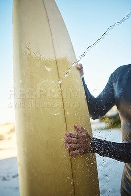 Buy stock photo Beach, surfing and man cleaning a board while on holiday at the ocean in Australia during summer. Hands of a surfer washing his surfboard at the sea during travel vacation for adventure on an island