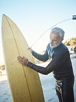 Old man, beach and surfer cleaning surfboard, surfing in Mexico on summer holiday or vacation. Washing, shower and elderly retired male remove sand on board after surf or training exercise in ocean.