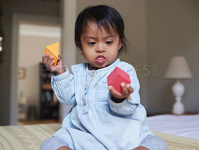 Buy stock photo Creative, learning and building blocks with baby with down syndrome at home for education, health or wellness. Family, disability and youth with child playing with toys for games, development and fun