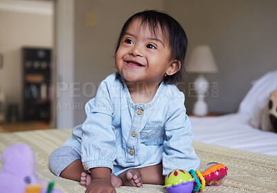 Buy stock photo Down Syndrome, smile and happy baby relax on bed having fun, play with toys and enjoy happiness at home. Intellectual disability, mentally disabled and child development for young toddler in bedroom