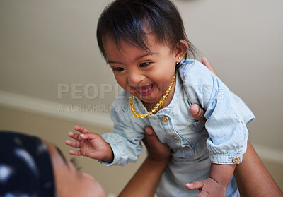 Buy stock photo Children, down syndrome and fun with a girl and mother playing together in their home. Family, kids and disability with an adorable or cute daughter laughing with her parent while being playful