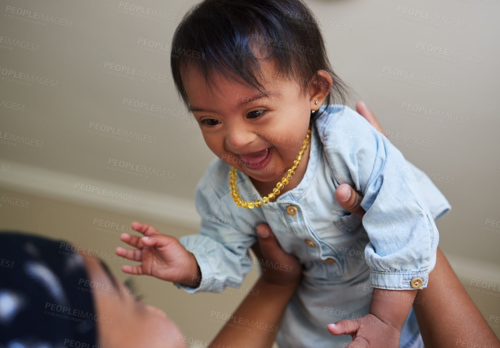 Buy stock photo Children, down syndrome and fun with a girl and mother playing together in their home. Family, kids and disability with an adorable or cute daughter laughing with her parent while being playful