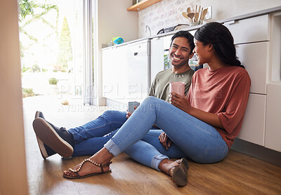 Buy stock photo Couple communication, love with coffee in the kitchen and happy together to bond in the morning. Man and woman in India on floor, smile while in conversation and romance and healthy relationship. 

