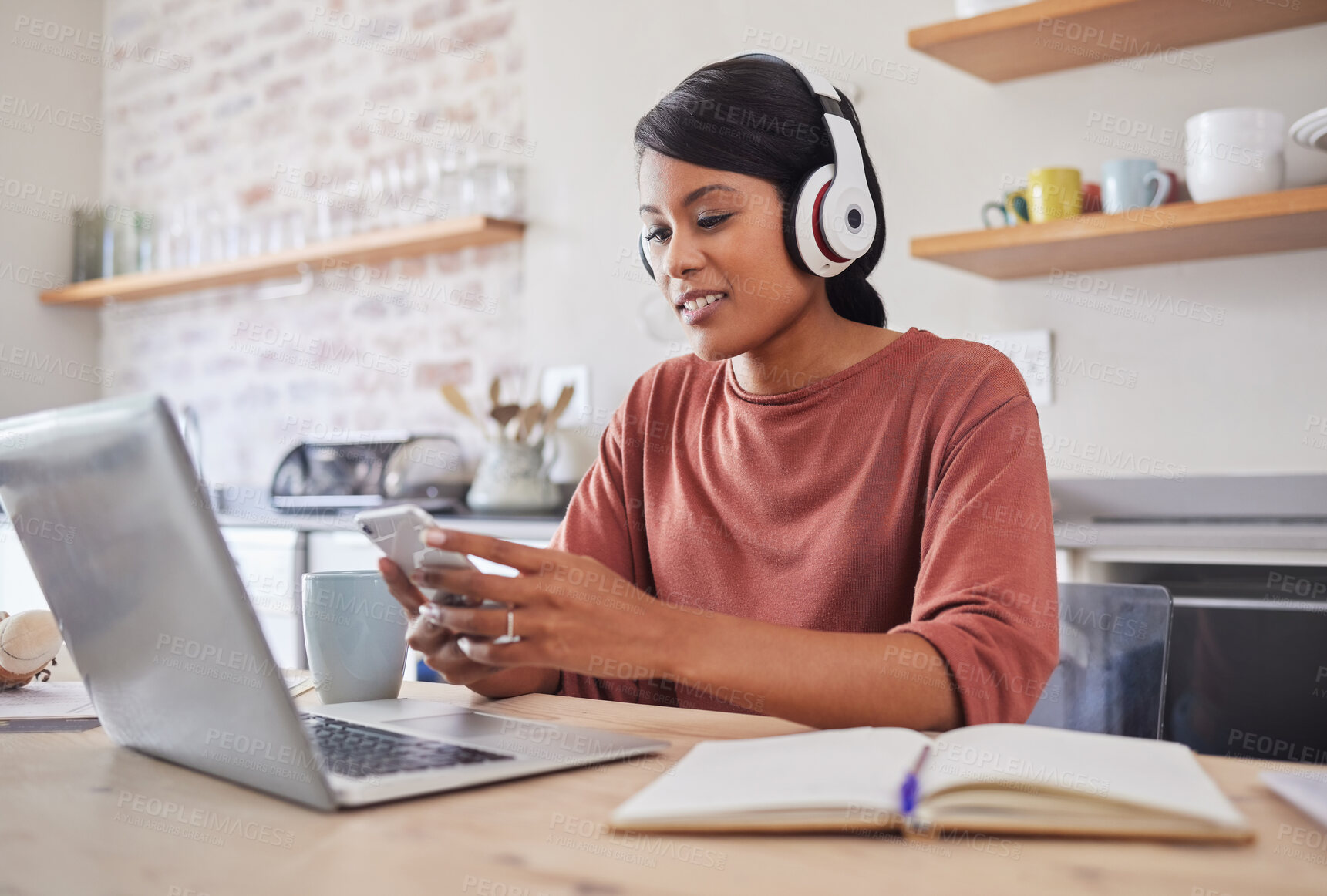 Buy stock photo Social media, music and business woman typing an email on a mobile app on phone working on laptop in house. Remote entrepreneur or worker reading on the internet, listening to radio and planning work