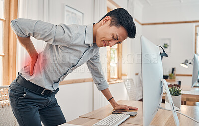Buy stock photo Businessman with back pain, muscle injury and burnout at office desk. Young frustrated man suffering from spinal inflammation, body discomfort or strain and healthcare stress emergency






