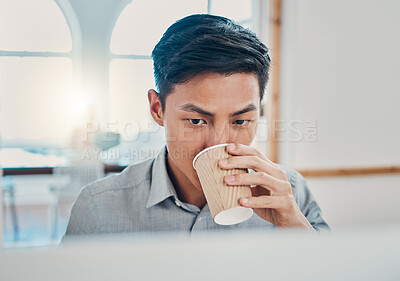 Buy stock photo Coffee, computer and commitment with a businessman working in a corporate office for online project. Asian male professional at work on a pc at his desk planning for a global or international project