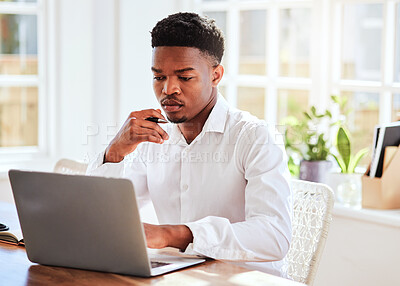 Buy stock photo Office, laptop and african businessman working on a project and doing research on the internet. Technology, young and professional black man reading corporate company documents on his computer.