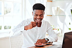 Black business man with tea, cafe restaurant for online work and happy startup manager in Chicago. Working at company kitchen table with laptop, coffee break from tech office and employee relaxing