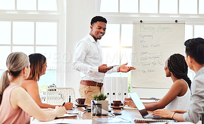 Buy stock photo Business meeting, corporate management presentation and black man leader coaching team in modern office. Boardroom discussion, company mentor training and research or planning innovation seminar

