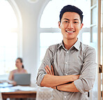 Asian man, leader and in office stand happy, proud and confident at workplace and with cross arms. Portrait, businessman and entrepreneur focus, positive and smile for successful project in workspace