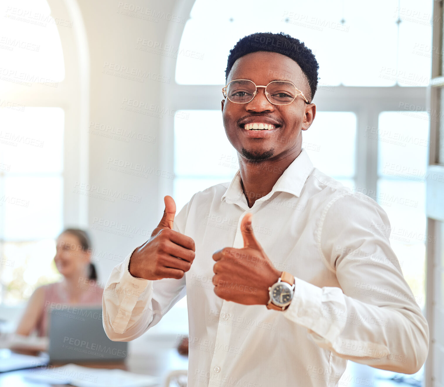 Buy stock photo Thumbs up, hands and portrait of an african businessman standing in a modern office during a meeting. Happy, smile and black employee with an approval, agreement and yes gesture in the workplace.