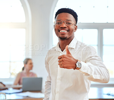 Buy stock photo Thumbs up, happy and african businessman with a smile standing in his modern company office. Approval gesture, professional and portrait of a a black corporate employee with his thumb up in agreement