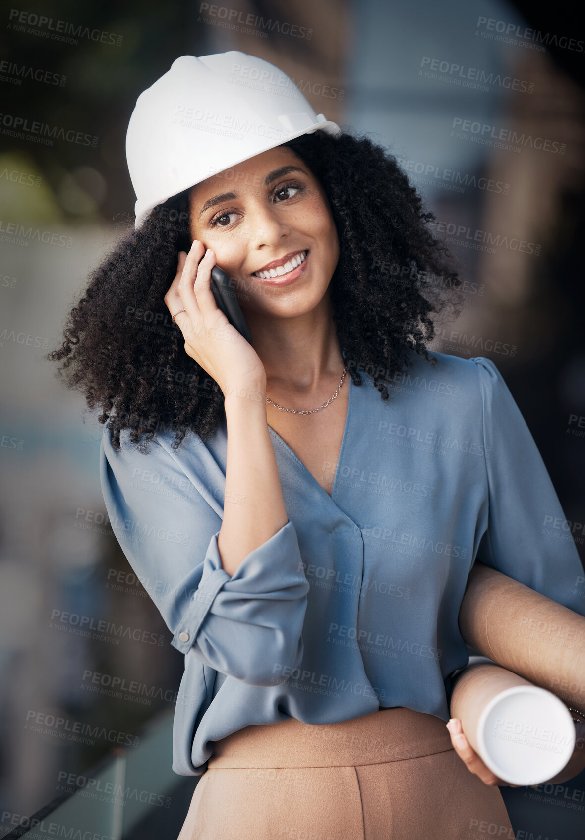 Buy stock photo Architect, phone call and black woman talking on smartphone, holding blueprint with smile outside construction, architecture and engineering industry. Happy african female worker talking to contact
