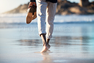 Buy stock photo Man, beach and walking feet in water in summer with shoes in hand to relax, breathe and thinking. Ocean, walk and sunshine for mindfulness, calm and peace at sea, nature and outdoor in Cape Town