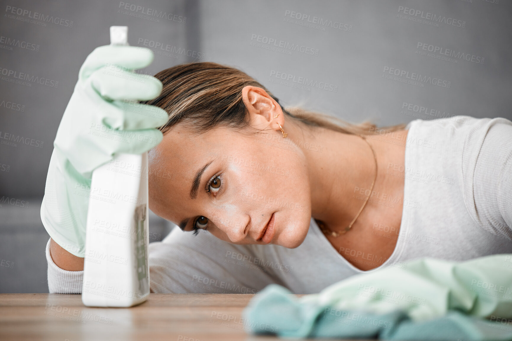 Buy stock photo Spring cleaning house, tired and sad woman in home living room with burnout, stress and frustrated spray task. Bored, thinking and depression chores, housekeeping cleaner and exhausted maid service