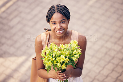 Buy stock photo Flowers, gift and black woman with smile for bouquet for birthday or celebration in the street from above. Face of an African girl with a present of yellow lilies in the road and the city of France