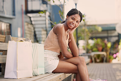 Buy stock photo Shopping, black woman and smile after a shop, retail and luxury store trip with happiness. Portrait of a happy young female from Jamaica in the city sitting on a urban park bench smiling with joy