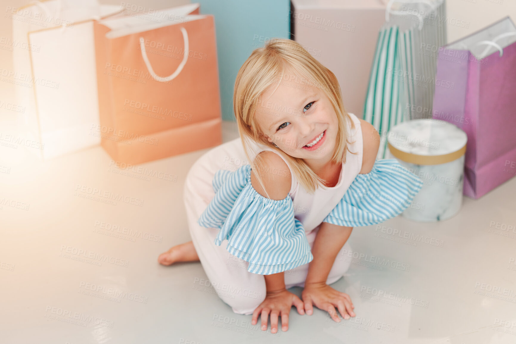 Buy stock photo Birthday, gift or present with girl child portrait for fashion, boutique and luxury lifestyle. Kid on floor with shopping bags, young retail customer for children discount, clothes sale marketing 