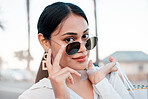 Face, fashion and woman in sunglasses with shopping bags in city for designer clothing in mall or boutique. Portrait, wealth or rich woman smile or retail customer from Brazil in cool stylish glasses