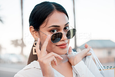 Buy stock photo Face, fashion and woman in sunglasses with shopping bags in city for designer clothing in mall or boutique. Portrait, wealth or rich woman smile or retail customer from Brazil in cool stylish glasses