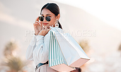 Buy stock photo Woman, classy fashion and shopping with bags in luxury designer clothes for wealthy lifestyle. Portrait of a rich female shopaholic or shopper with glasses in travel and retail spree in Puerto Rico