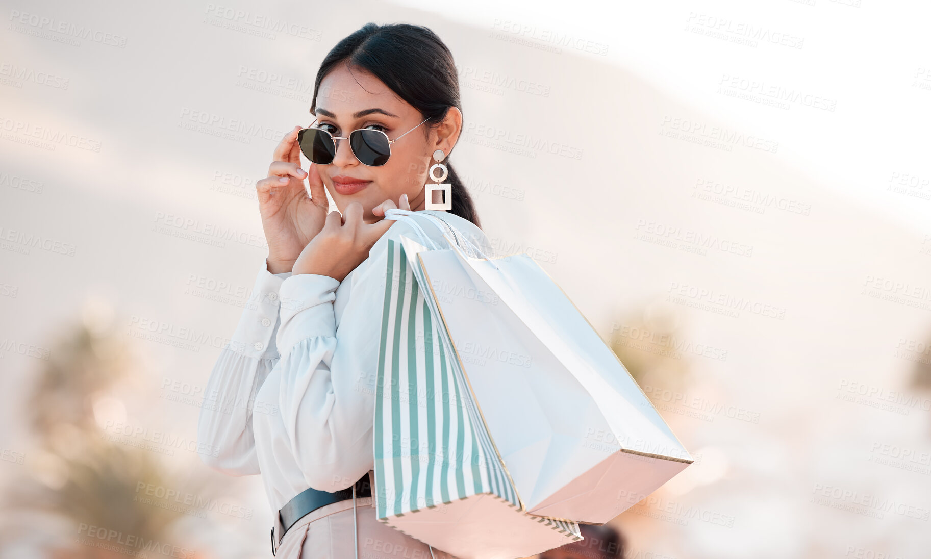 Buy stock photo Woman, classy fashion and shopping with bags in luxury designer clothes for wealthy lifestyle. Portrait of a rich female shopaholic or shopper with glasses in travel and retail spree in Puerto Rico