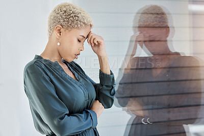 Buy stock photo Black woman, stress and work with mental health, tired and anxiety by window depressed in office. Professional, career and sad girl frustrated with headache, burnout and depression at job in New York