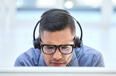 Buy stock photo Call center worker in communication with people on internet online with computer at work, customer care help and contact us consulting at crm company. Man telemarketing employee working in an office