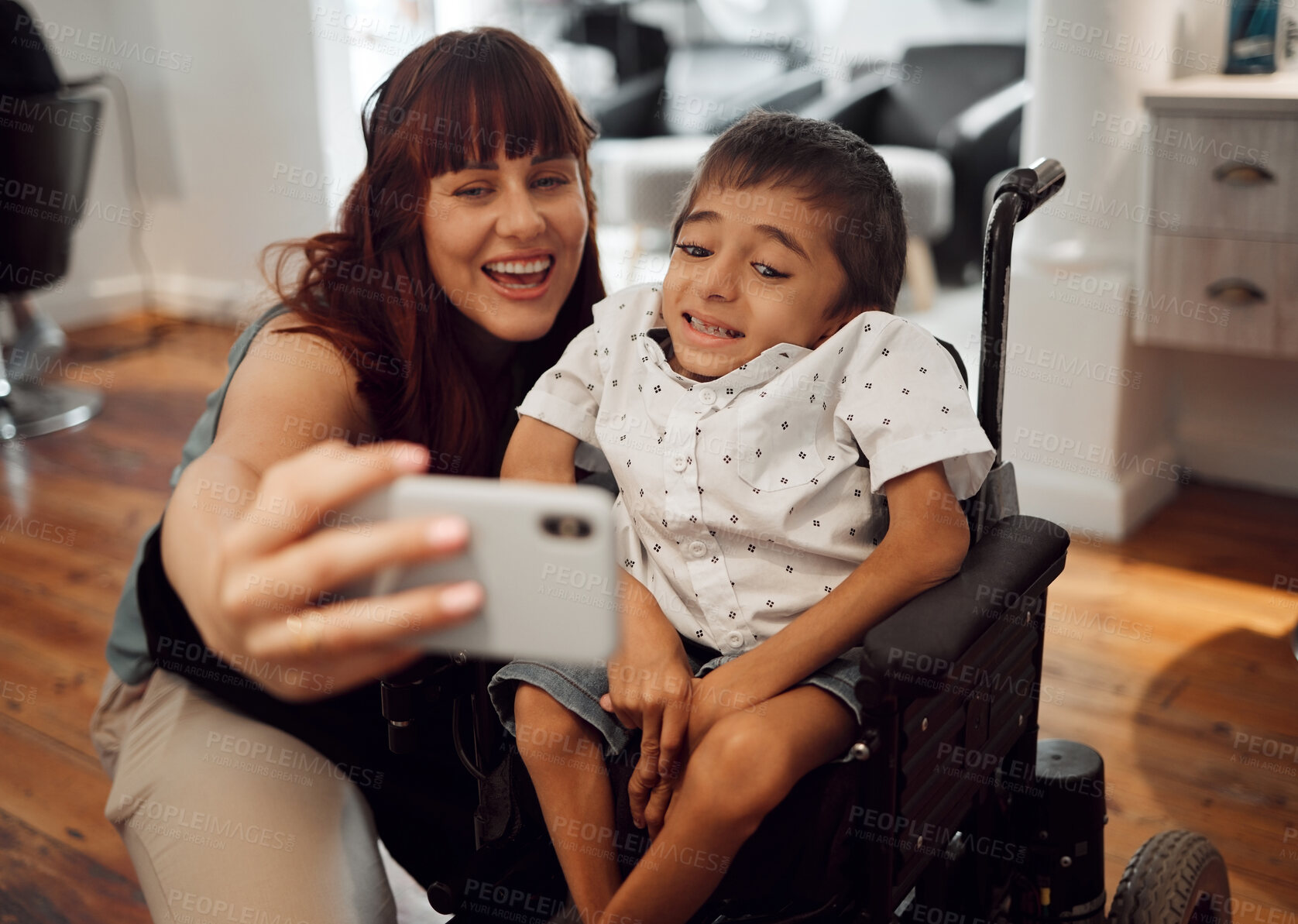 Buy stock photo Child, cerebral palsy and happy phone selfie of a mobile disability boy in a wheelchair. Woman or mother smile with a young kid using technology to take a picture together with happiness and care 