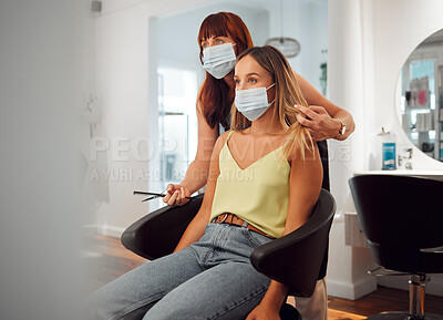 Buy stock photo Covid, hairdresser and woman in hair salon getting haircut looking in mirror. Hairdressing, hair care and beauty business in covid 19 crisis. Woman with scissors to cut hair of client with face mask