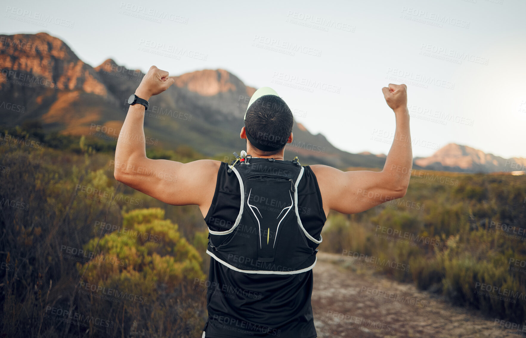 Buy stock photo Winner, mountain and runner man success with back view celebrating cardio exercise goal victory. Muscular, strong and fitness lifestyle male running achievement celebration in South African bush.