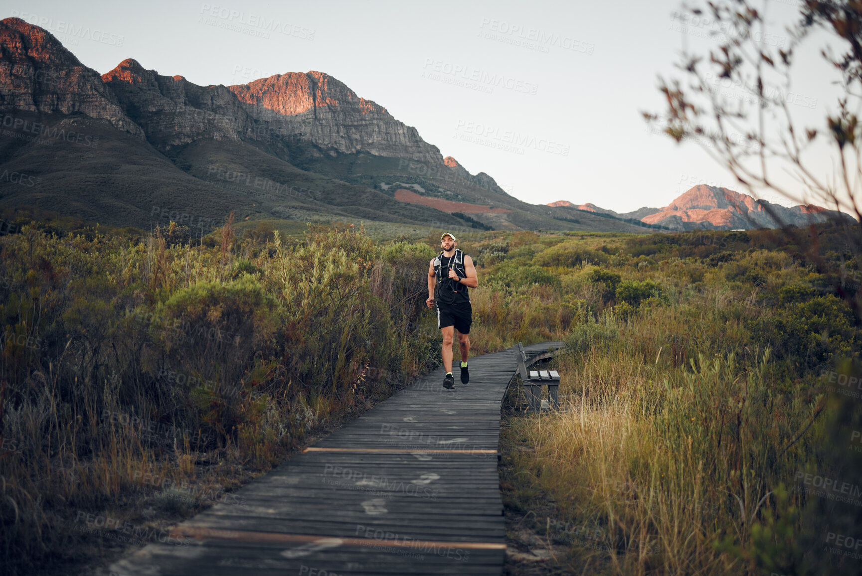 Buy stock photo Health, man runner and in nature for training, wellness and fitness outdoor in the morning in sportswear. Exercise, male athlete, running on trail and workout warm up to be healthy and do cardio.