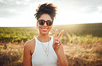 Peace sign, travel and black woman on safari holiday during summer in Kenya. Portrait of a happy, relax and African girl with hand for freedom, adventure and happiness on vacation in the countryside