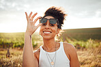 Young black woman, sunset portrait in field countryside and happy smile with summer sunglasses in Brazil. Outdoor adventure in nature, travel freedom on vacation and holiday 
trip alone in sunshine
